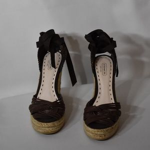 Brown leather Coach wedge sandals.